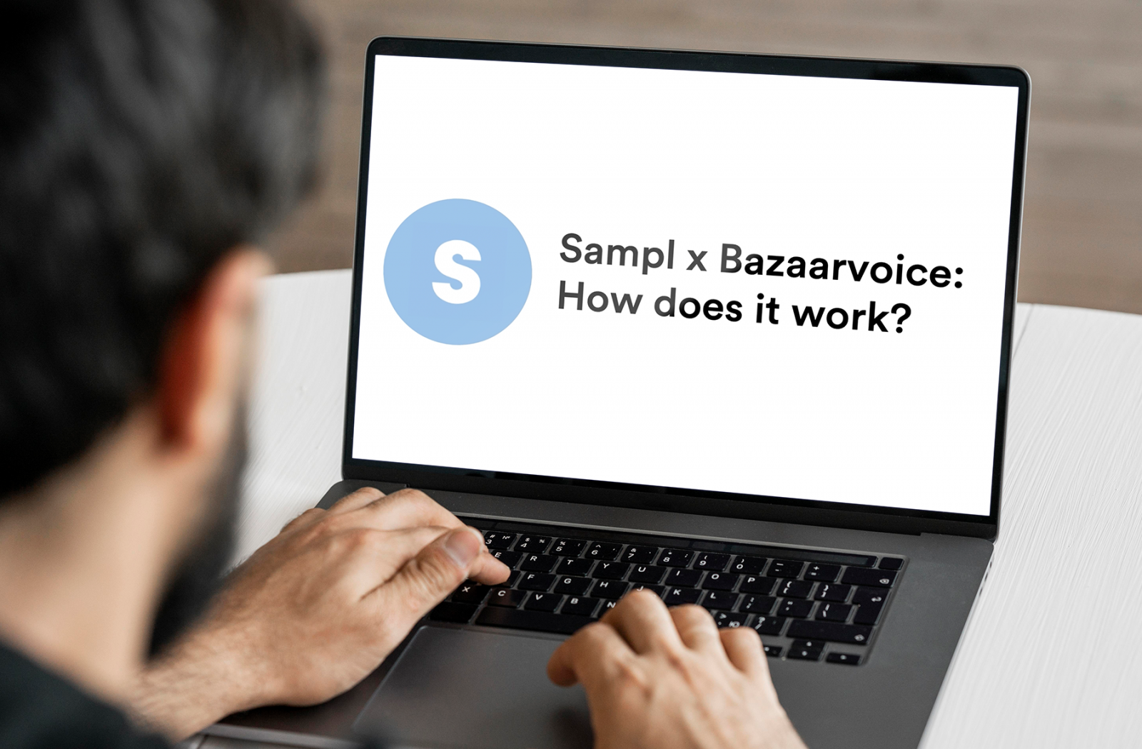 Man on laptop researching what is Bazaarvoice and how does it work for digital sampling
